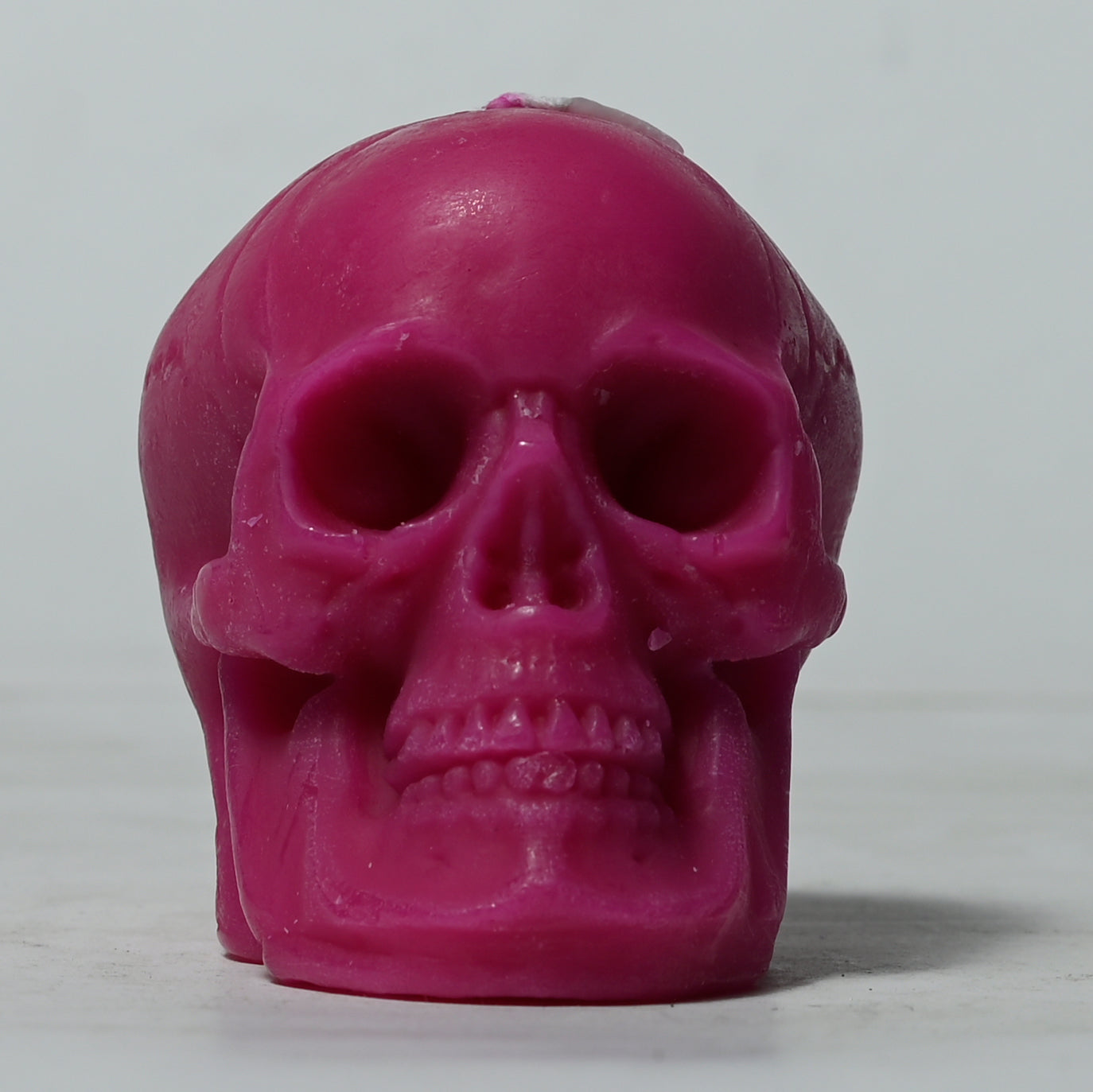 Real Human Skull Figure Candle Dark Pink