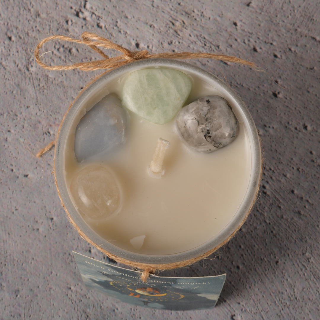 Real Intention Candles Infused with Amazonite, Angelite, Rainbow Moonstone and Clear Quartz- The Silver of Night and the Golden of Delight with scentnotes of the blue ocean